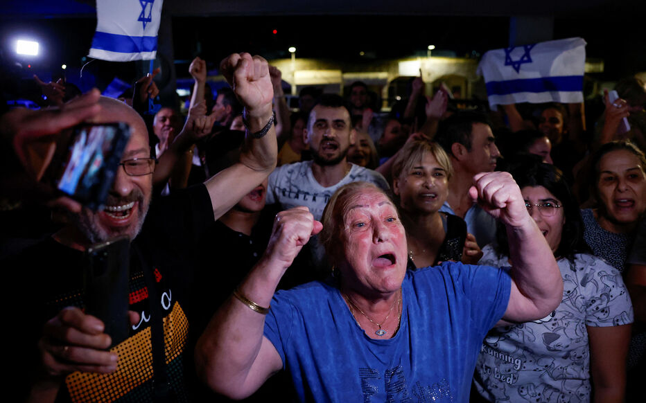 Family and friends of Israeli soldier Ori Megidish, who was taken hostage by Hamas, react to the news of her release, in Kiryat Gat